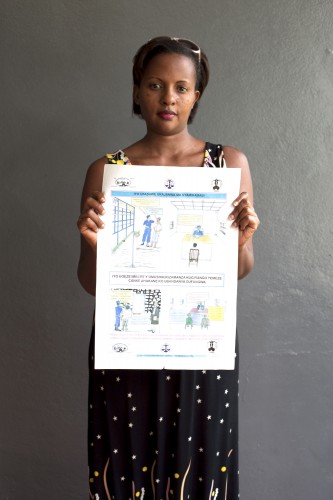 Selene showing a rights awareness poster prepared and distributed by IBJ's team in Bujumbura