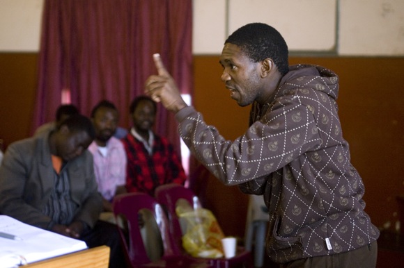 Alfred Magagula leads a discussion during a workshop with community police in Ngwenya