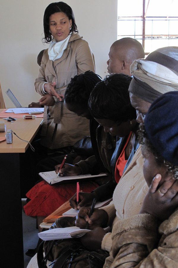 Gugu Simelane interacts with community members during a workshop in Matsanjeni