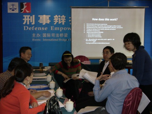 Participants discuss the transformative learning cycle.