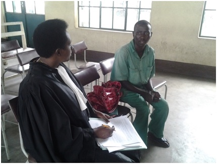 Lawyer Aline Nijimbere interviewing her client