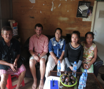 Thyda and her family, IBJ intern Jake Mooney and IBJ lawyer Ms Chan Reaseypheak (in the middle)